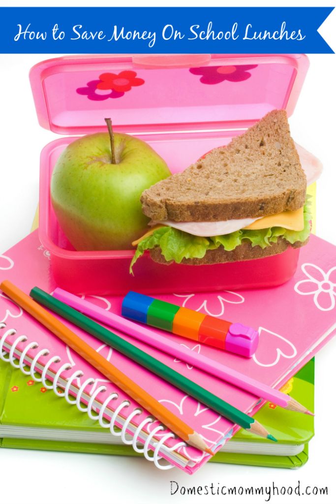 books, color pens and lunch box with sandwich